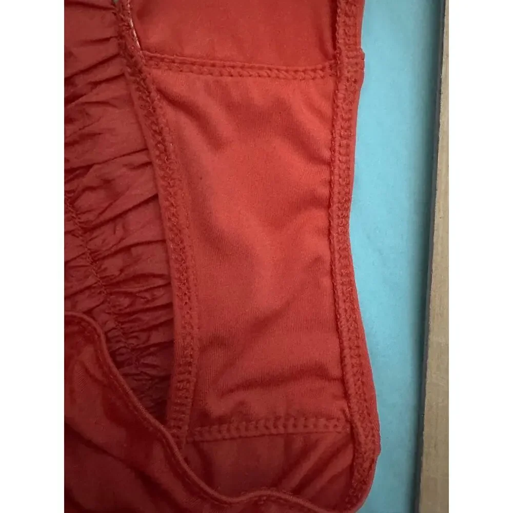 Free People FP Movement Way Home shorts in a vibrant coral reddish-orange color